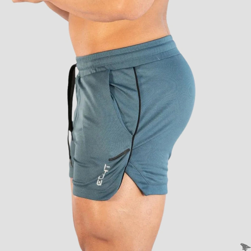Perfil lateral do short de treino Echt na cor azul, destacando o comprimento curto e a abertura lateral para maior mobilidade.